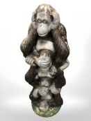 A plastic column in the form of three monkeys 