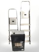 Two aluminium step ladders and a gas heater