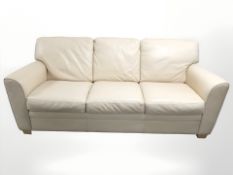A contemporary cream stitched leather three seater settee,