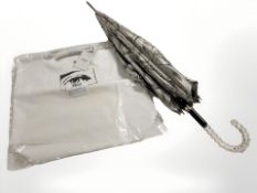 A silk umbrella and a Calvin Klein shoulder bag