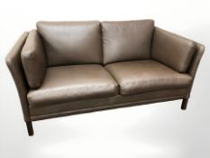 A late 20th century Danish brown leather two seater settee, 150 cm W x 80 cm D x 73 cm H.