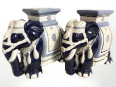 A pair of ceramic elephant plant stands, height 43 cm.