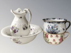 A pottery wash jug and basin, and two further chamber pots.
