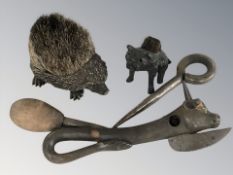 A 19th century can opener in the form of a cow,