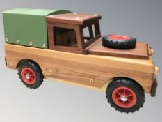 A handmade wooden miniature model of a Land Rover, length 50 cm.