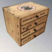 A four drawer counter top pine chest, with later Dewhurst's advertising, width 32 cm.