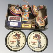 A group of vintage toys including tin plate spinning tops, buckets,