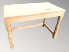 A blonde oak rectangular occasional table, width 66 cm.