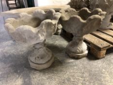 A pair of concrete garden planters,