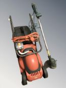 An electric lawn mower and a grass strimmer