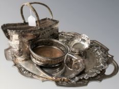 An EPNS pierced twin handled serving platter, two others smaller, a swing handled basket,