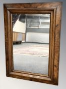 A 19th century walnut mirror,