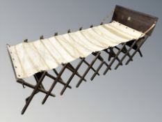 An oak 'Cabinetta' folding military campaign bed, width 80 cm.