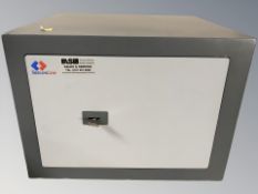 A Secure Line safe with key, 44 cm W x 40 cm D x 32 cm H.