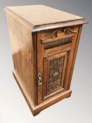 A Victorian carved walnut bedside cabinet,