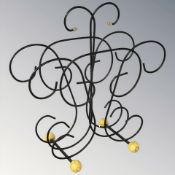 A mid-century wire metal newspaper stand, height 34 cm.