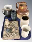 A group of stoneware jugs and vessels, Celtic pottery vase, relief panel depicting figures, etc.