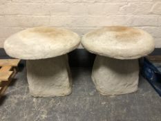 A pair of concrete mushroom staddle stones,
