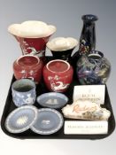 A Crown Devon pegasus red ground vase and matching pair of jars with covers,