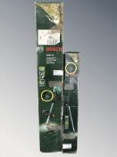 Two Bosch electric garden multi tools in boxes.