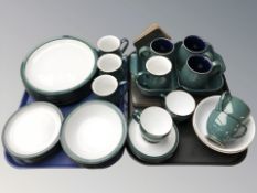 Thirty four pieces of Denby turquoise glazed table wares and a group of coasters and placemats.