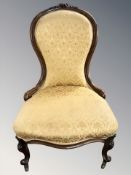 A Victorian carved walnut lady's salon chair