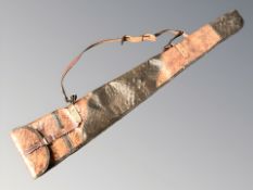 A faux crocodile leather gun slip.