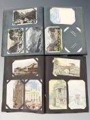 Two albums of antiquarian monochrome and coloured postcards, British and European landscapes,