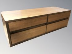 A small teak chest fitted with four drawers,