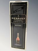 A bottle of Renault Cognac Carte Noire Extra, 1 litre, in carton.