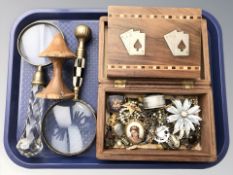 An inlaid hardwood playing card box containing Wills cigarette cards,