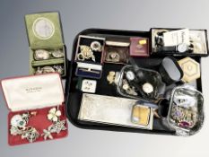 A group of costume jewellery including brooches, earrings, simulated pearls,