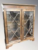 A late Victorian glazed double door glazed table top display cabinet,