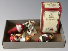 A Royal Doulton Bunnykins figure 'Girl Skater' with box, and three novelty Christmas tree baubles,
