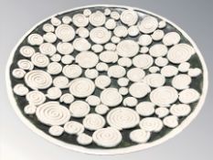 An Earthenware shallow bowl with applied swirl motif, stamped 'Florian', diameter 28 cm.