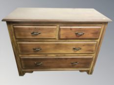 An Edwardian walnut four drawer chest, 107 cm W x 50 cm D x 82 cm H.