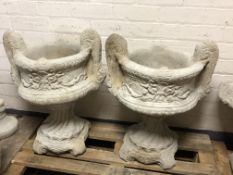 A pair of concrete twin handled garden planters,