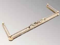 A Victorian brass fender.