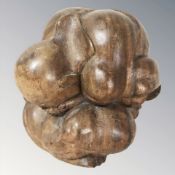 A carved wooden sculpture of a man with head in hands, height 24 cm.