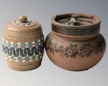 A Doulton Lambeth stoneware jar and cover, and a further terracotta jar and cover, height 12 cm.