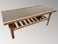 A 20th century teak and melamine rectangular coffee table with under shelf,