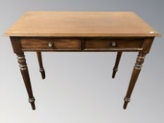 A late Victorian mahogany side table, fitted two drawers, 100 cm W x 51 cm D x 79 cm H.