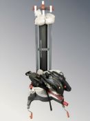 A Performance Redeye 255mm slide compound mitre saw, with instructions and collapsible stand.