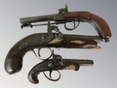 Three reproduction percussion cap pistols, largest 30 cm long.
