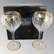 A boxed pair of Stuart wine glasses, two others matching and various crystal decanters, etc.