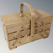 A concertina sewing box, width 33 cm.