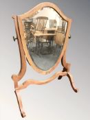 A Victorian mahogany shield-shaped swing mirror,