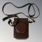 A stitched Burgundy leather Leica camera case.