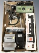 A boxed woodworking lathe, small bench saw, disk sander and other tools.