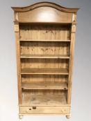 A contemporary pine open bookcase, 110 cm W x 45 cm D x 212 cm H.